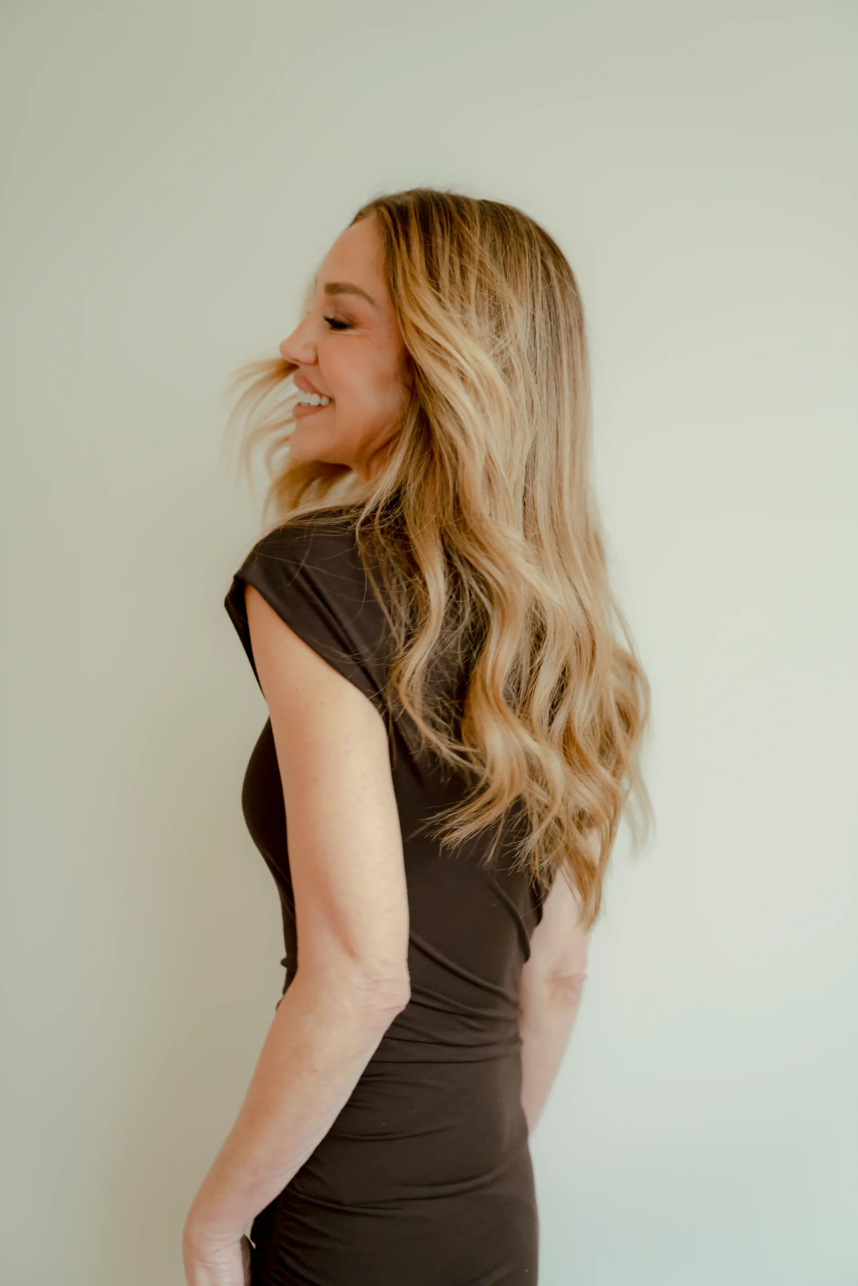 Chrissie Carter fashion career coach smiling in a black dress, representing confidence and career clarity